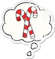 cartoon candy canes and thought bubble as a distressed worn sticker vector