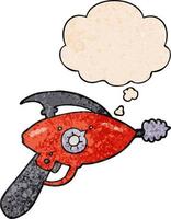 cartoon ray gun and thought bubble in grunge texture pattern style vector