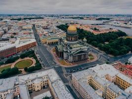 Beautiful view of St. Petersburg from height. St. Isaacs Cathedral during cloudy day. Streets of Russian cities. Scenic view. Nice city. photo