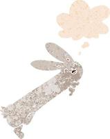 funny cartoon rabbit and thought bubble in retro textured style vector