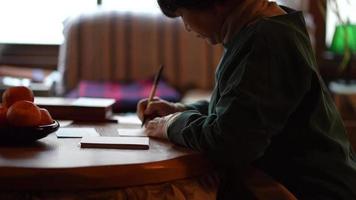 Woman writing a New Year's card