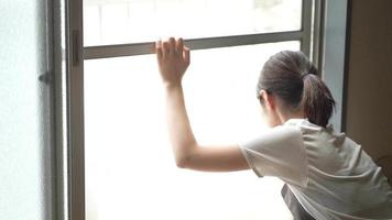 A woman cleaning a screen door video