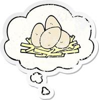 cartoon eggs in nest and thought bubble as a distressed worn sticker vector