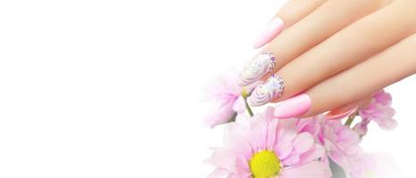 Young beautiful woman hands with elegant manicure photo