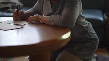 Woman writing a letter video