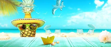 Creative pineapple with sunglasses on summer background. photo