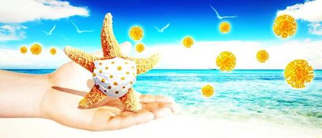 Starfish with corona virus masks on vacation photo