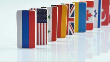 Domino effect with tile of flags of different countries of the world video