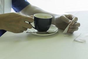 A man holding a cup of coffee photo