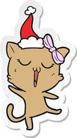 sticker cartoon of a cat wearing santa hat vector