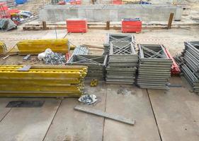 Group of the metal frame and equipment pile on the concrete groundsheet . photo