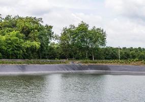 Small reservoir with the plastic sheet. photo