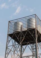 steel water tank on the metal tower photo