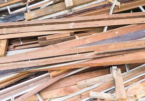 Large lumber pile from the broken house. photo