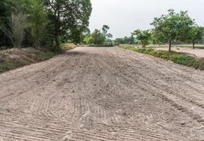 The sandy soil was plowing for ready to cultivation. photo