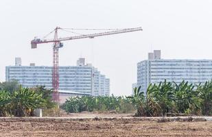 Modern high crane in the construction site. photo