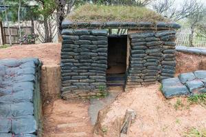 Cement shelter with sandbag photo