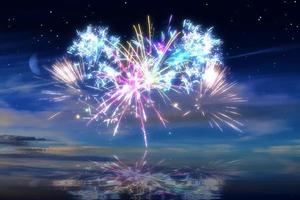 Beautiful happy new year fireworks in the sky with reflections on water photo