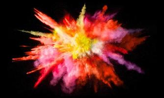 Colorful powder explosion, isolated on black background photo