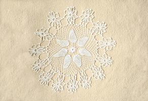 napkin knitted with white thread photo