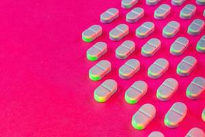 searching for the virus cure medical pills in pattern on vibrant background photo