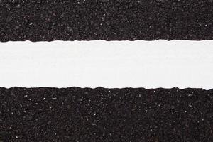 Asphalt dark texture with white line photo