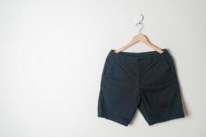 short pants hanging on wall photo