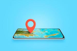 teléfono como concepto de mapa. pin de mapa anclado a la pantalla del teléfono donde se encuentra el mapa. el concepto de viajes de verano y encontrar un destino de vacaciones foto