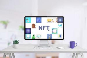 Computer display on work desk with NFT art concept. Non-fungible token composition concept photo