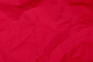 fondo de textura de papel arrugado rojo. fondo de textura de papel arrugado rojo. fondo de textura de tela de pliegue rojo. fondo de textura de tela arrugada roja. foto