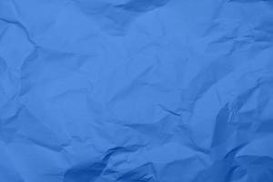 fondo de textura de papel arrugado azul. fondo de textura de papel arrugado azul. fondo de textura de tela de pliegue azul. fondo de textura de tela arrugada azul.