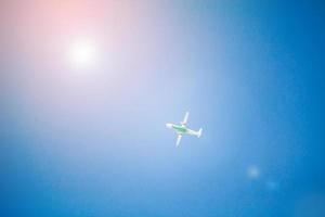 Airplane flying with blue sky photo