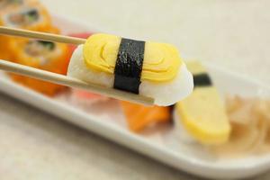 Sushi with chopsticks photo