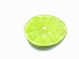 Fresh half cut of Tahiti lemon with water drop isolated over white photo