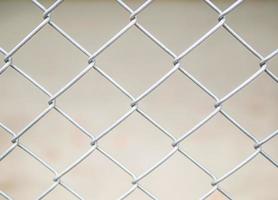 Close up of steel wire mesh fence background photo