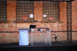 Empty DJ booth against a brick wall. Party at a closed factory photo