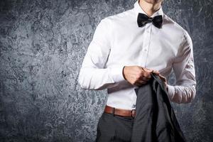 Stylish man in suit with bow tie photo