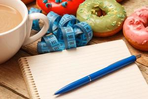 Colorful donuts and notepad photo