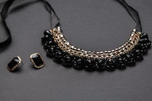 Necklace  and earrings with black stones photo