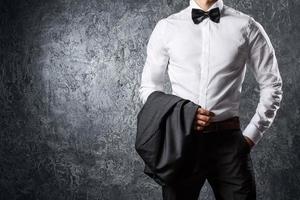 Stylish man in suit with bow tie photo