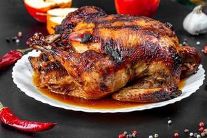 Baked chicken stuffed with apples with spices, chili and fresh apples