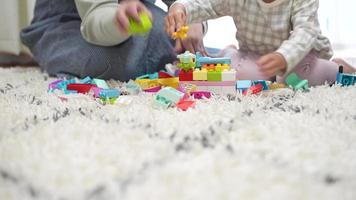 Parents and children playing with blocks video