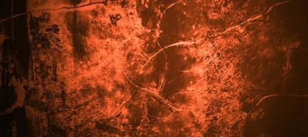 concepto de fondo de halloween de pared amarillo naranja rojo oscuro. fondo de miedo. textura de cemento de hormigón de terror para el fondo. foto