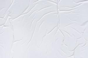 textura arrugada de papel en blanco y fondo de póster de papel arrugado. fondos húmedos de textura de papel arrugado para diversos fines. fondo de textura arrugada de papel de carteles realistas. foto