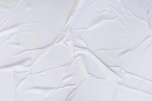 textura arrugada de papel en blanco y fondo de póster de papel arrugado. fondos húmedos de textura de papel arrugado para diversos fines. fondo de textura arrugada de papel de carteles realistas. foto