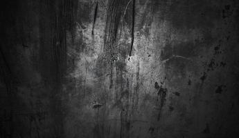 concepto de fondo de halloween de pared oscura y negra. hormigón negro polvoriento para el fondo. textura de cemento de terror foto