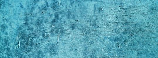 Blue wall background.concrete wall plastered blue scratch background.grunge texture. photo