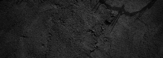 fondo de textura de piedra granulada áspera de color gris oscuro o de miedo de pared negra. hormigón negro para el fondo. foto