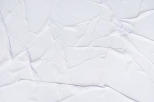 textura arrugada de papel en blanco y fondo de póster de papel arrugado. fondos húmedos de textura de papel arrugado para diversos fines. fondo de textura arrugada de papel de carteles realistas. foto