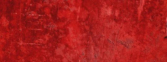 Red wall.scary background.concrete wall plastered red scratch background.grunge texture. photo